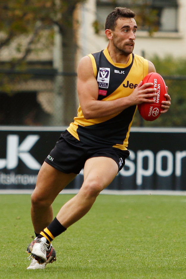 VFL 2016 Rd 02 - Richmond v Footscray MELBOURNE, AUSTRALIA - APRIL 16: Adam Marcon of Richmond runs with the ball during the round two VFL match between the Richmond Tigers and the Footscray Bulldogs at Punt Road Oval on April 16, 2016 in Melbourne, Australia. (Photo by Jack Thomas/AFL Media/Getty Images)